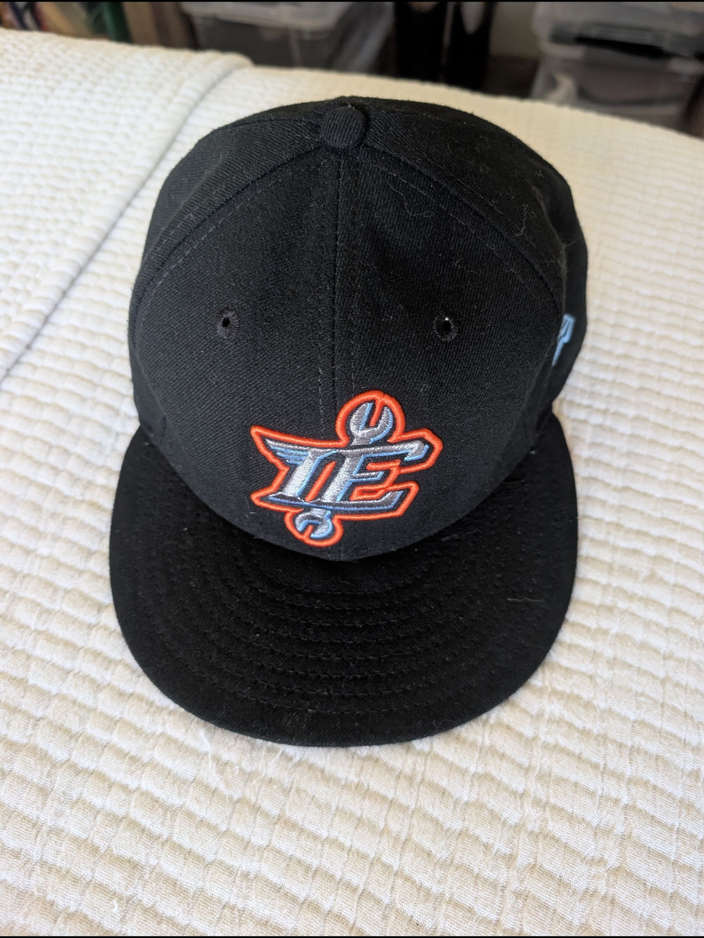 Black Baseball Cap with Orange & Light Blue Embroidered Logo
